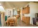 Open-concept dining area with wood table, chairs, and seamless flow into kitchen and living spaces at 1640 E Augusta Ave, Chandler, AZ 85249