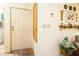 Inviting entryway with a white door, neutral wall color, and decorative elements adding character to the space at 1640 E Augusta Ave, Chandler, AZ 85249