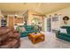 Spacious living room with seamless flow to dining area, slider to patio, and neutral color palette at 1640 E Augusta Ave, Chandler, AZ 85249