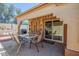 Charming covered patio with a table and chairs, perfect for outdoor entertaining and relaxation at 1640 E Augusta Ave, Chandler, AZ 85249