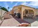 Inviting outdoor patio with brick accents, covered area with ceiling fan, and dining set for entertaining at 1640 E Augusta Ave, Chandler, AZ 85249
