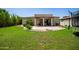 Well-manicured backyard with a tiled patio, perfect for outdoor entertaining at 1804 W Magdalena Ln, Phoenix, AZ 85041