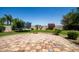 Lush backyard with a trampoline, stone patio, and manicured landscaping at 1804 W Magdalena Ln, Phoenix, AZ 85041
