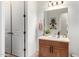 Bathroom featuring neutral counter tops, wood cabinetry and white walls at 1804 W Magdalena Ln, Phoenix, AZ 85041