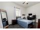 Cozy bedroom with dark wood floors, a comfortable bed and neutral walls at 1804 W Magdalena Ln, Phoenix, AZ 85041
