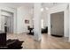 Spacious foyer featuring tile flooring, high ceilings, and an open view to the office at 1804 W Magdalena Ln, Phoenix, AZ 85041