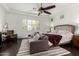 Well-lit main bedroom showcases a large bed, a comfortable sofa, and bright shuttered windows at 1804 W Magdalena Ln, Phoenix, AZ 85041