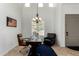 Bright office featuring a chandelier, large windows and plenty of space to work at 1804 W Magdalena Ln, Phoenix, AZ 85041