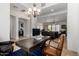 Bright office featuring a chandelier, a view of the living room and plenty of space to work at 1804 W Magdalena Ln, Phoenix, AZ 85041