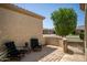 Outdoor patio with brick flooring, seating, and a charming garden view at 1804 W Magdalena Ln, Phoenix, AZ 85041