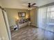 This bright bedroom features a built in bookcase headboard and sliding glass door to the balcony at 1825 W Ray Rd # 1134, Chandler, AZ 85224