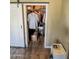 Walk in closet with hanging clothes and shelves behind a sliding barn door at 1825 W Ray Rd # 1134, Chandler, AZ 85224