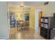Inviting dining room with stylish light fixture, books, and wood floors at 1825 W Ray Rd # 1134, Chandler, AZ 85224