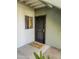 Inviting front entryway featuring a black security door and a welcome mat, showcasing a welcoming entrance to the residence at 1825 W Ray Rd # 1134, Chandler, AZ 85224