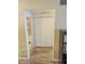 Hallway with tile flooring leading to a laundry closet and bathroom at 1825 W Ray Rd # 1134, Chandler, AZ 85224