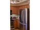 Well-equipped kitchen featuring stainless steel appliances and warm wood cabinetry at 1825 W Ray Rd # 1134, Chandler, AZ 85224