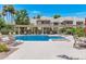 Community pool featuring a pergola with seating and well-manicured landscaping for a resort-like feel at 1825 W Ray Rd # 1134, Chandler, AZ 85224