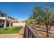 The backyard features a nice view, low-maintenance turf and privacy fence at 18401 W Westfall Way, Surprise, AZ 85374
