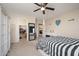 Well-appointed bedroom with modern decor, walk-in closet, and neutral color scheme at 18401 W Westfall Way, Surprise, AZ 85374