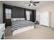 Comfortable bedroom with modern decor, large window, and neutral color scheme at 18401 W Westfall Way, Surprise, AZ 85374