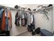 Functional walk-in closet with ample hanging space and storage shelves at 18401 W Westfall Way, Surprise, AZ 85374