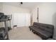Workout room with exercise equipment and a sofa for relaxing at 18401 W Westfall Way, Surprise, AZ 85374