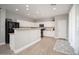 Modern kitchen featuring white cabinets, granite countertops, and stainless steel appliances at 18401 W Westfall Way, Surprise, AZ 85374