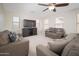 Inviting living room with a ceiling fan and plenty of seating, perfect for relaxation and entertaining at 18401 W Westfall Way, Surprise, AZ 85374
