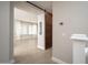 Bright living room with wood floors, neutral colors, and a barn door adds rustic charm at 18401 W Westfall Way, Surprise, AZ 85374