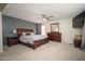 Beautiful main bedroom with luxurious wood furniture and natural light at 18401 W Westfall Way, Surprise, AZ 85374