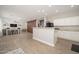 Spacious open concept living area with kitchen, dining, and living room with plenty of room for entertaining at 18401 W Westfall Way, Surprise, AZ 85374