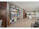View of the open pantry adjacent to kitchen, featuring shelving filled with canned goods and snacks at 18401 W Westfall Way, Surprise, AZ 85374
