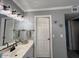 Bathroom boasts double sinks, an array of mirrors, and a seated vanity at 19014 N 91St Dr, Peoria, AZ 85382