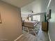 Comfortable bedroom boasts large windows, soft carpeting, and a ceiling fan at 19014 N 91St Dr, Peoria, AZ 85382
