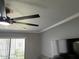 Living room ceiling fan and crown molding details adding a touch of elegance at 19014 N 91St Dr, Peoria, AZ 85382