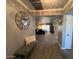 Welcoming entryway featuring a stylish bench, wood-look floors, and neutral colors at 19014 N 91St Dr, Peoria, AZ 85382