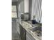 Bright kitchen with white cabinets, stainless steel sink, and granite countertop at 19014 N 91St Dr, Peoria, AZ 85382