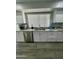 Bright kitchen with granite countertop and white cabinets at 19014 N 91St Dr, Peoria, AZ 85382