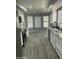 Bright kitchen with stainless steel appliances, granite countertops and white cabinets at 19014 N 91St Dr, Peoria, AZ 85382