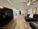 Bright living room featuring wood-look floors, open layout, and neutral paint at 19014 N 91St Dr, Peoria, AZ 85382