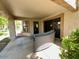 Relaxing outdoor patio with comfortable seating, and privacy from lush greenery at 19014 N 91St Dr, Peoria, AZ 85382