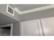 Ceiling trim detail with an AC vent at 19014 N 91St Dr, Peoria, AZ 85382