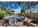 Inviting backyard pool area with lounge chairs and a fire pit, perfect for outdoor relaxation at 1922 E Everett Dr, Phoenix, AZ 85022