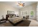 This bedroom offers a neutral palette with a modern ceiling fan, and a walk-out patio at 1922 E Everett Dr, Phoenix, AZ 85022