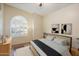 Comfortable bedroom featuring a large window, modern art, and well-lit space at 1922 E Everett Dr, Phoenix, AZ 85022