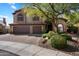 Charming two-story home features a three-car garage, desert landscaping, and stone accents at 1922 E Everett Dr, Phoenix, AZ 85022