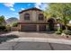 Elegant two-story home featuring a three-car garage and arched entry at 1922 E Everett Dr, Phoenix, AZ 85022