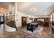 Spacious game room with a pool table, staircase, and comfortable seating area at 1922 E Everett Dr, Phoenix, AZ 85022