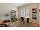 Cozy home office with built-in desk, ample natural light, and stylish shelving at 1922 E Everett Dr, Phoenix, AZ 85022