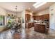 Bright kitchen featuring a skylight, an island, wood cabinetry, and an adjacent breakfast area at 1922 E Everett Dr, Phoenix, AZ 85022